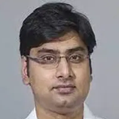 Dr. Alok T